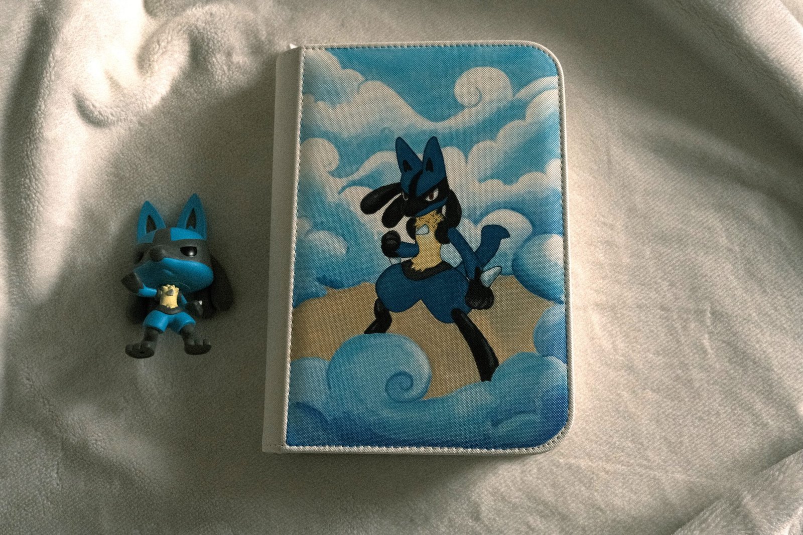Lucario painted on a card collection storage binder